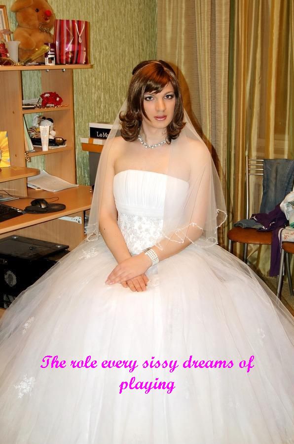 a woman in a white wedding dress posing for the camera