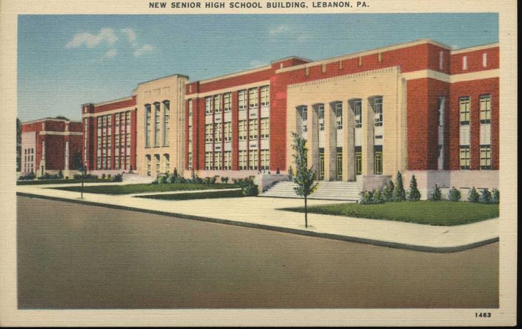 an old postcard shows the front of a school building