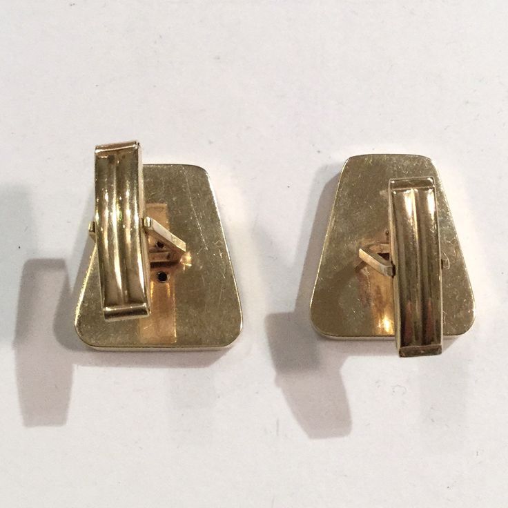 "These are beautifully made 1960s 14k gold cufflinks that recently came out of fine Midcentury Modern estate. They have a brushed Florentine type finish within a gold frame. There is a star sapphire in each cufflink. The cuffs have a very modernist kind of feel to them. The cufflinks are in great condition as you can see in the photos. One of the shanks is at a slight angle. They weight in at 11.8 grams of 14K gold for the two. They are marked \"14K\". The tops measure 7/8\" by 3/4\". The cuffli Antique Store Displays, Modern Estate, Van Cleef & Arpels, Gold Cufflinks, Star Sapphire, Silver Art, Store Display, Antique Stores, Gold Enamel