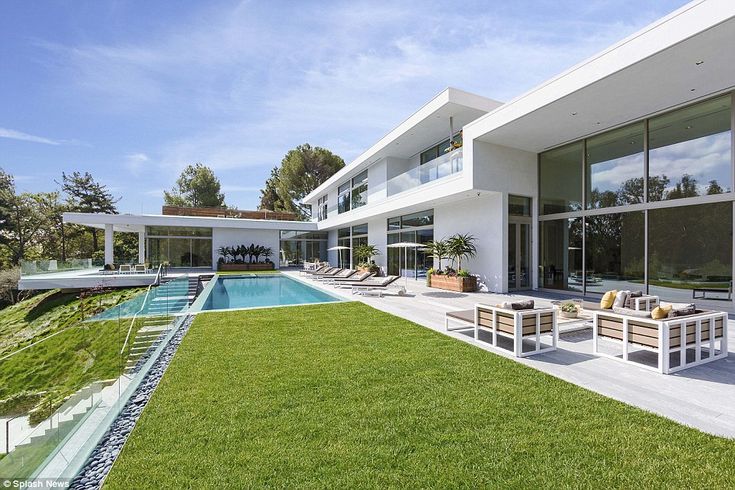 a modern house with a pool in the yard