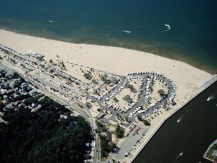 an aerial view of a parking lot on the beach