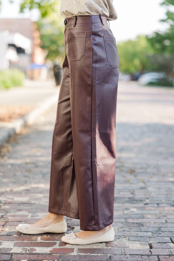 These wide leg pants are so chic! They will have you feeling so confident in your outfit, you'll be able to focus on any thing you put your mind too! That fabric is so perfect for the fall and these will look great with flowy blouses or cozy sweaters. Button/zip front closure Pockets Wide legs Faux leather fabric Minimal stretch Payton is wearing the small. Chic Wide-leg Leather Pants For Workwear, Faux Leather Wide Leg Pants For Fall, Faux Leather Wide-leg Pants For Fall, Fall Wide-leg Faux Leather Pants, Faux Leather Wide Leg Pants For Work, Date Night Wide Leg Faux Leather Pants, Wide Leg Faux Leather Pants For Date Night, Fall Wide Leg Faux Leather Pants, Fall Faux Leather Wide-leg Pants