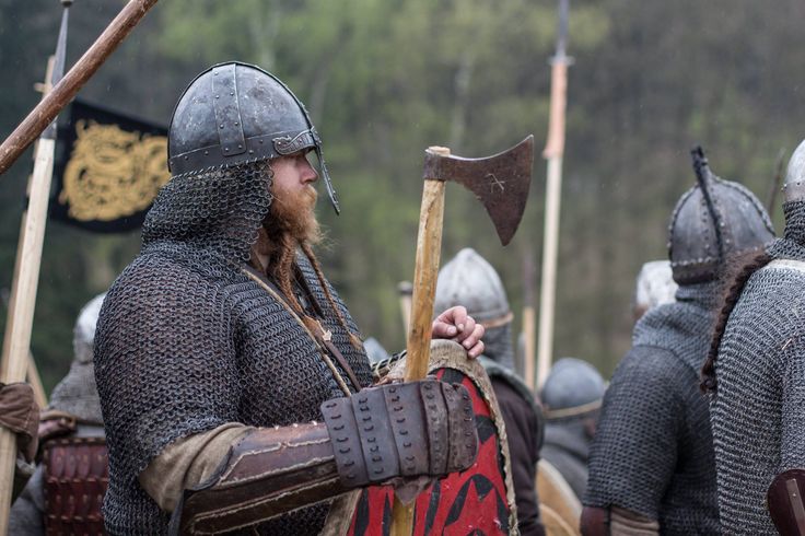 a group of men dressed in medieval armor