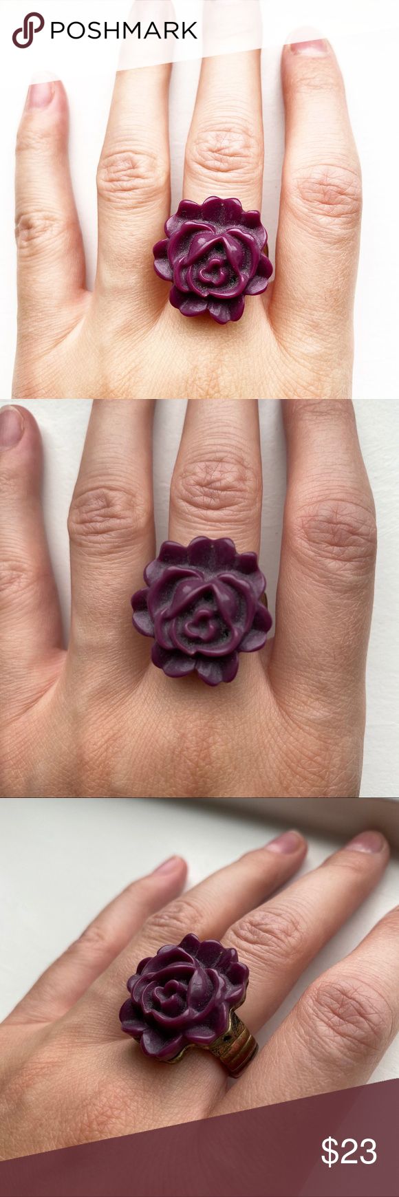 Vintage chunky purple flower ring Vintage chunky purple / wine-colored acrylic flower ring. The ring has a brassy gold tone metal ring band that is set on elastics and is meant to stretch to fit most ring sizes. The flower measures 1 inch by 1 inch by .25 inches. Some normal wear with use over time, but in great vintage condition! Vintage Jewelry Rings Vintage Jewellery Rings, Colored Acrylic, Acrylic Flower, Purple Wine, Acrylic Flowers, Ring Sizes, Wine Colored, Metal Ring, Purple Flower