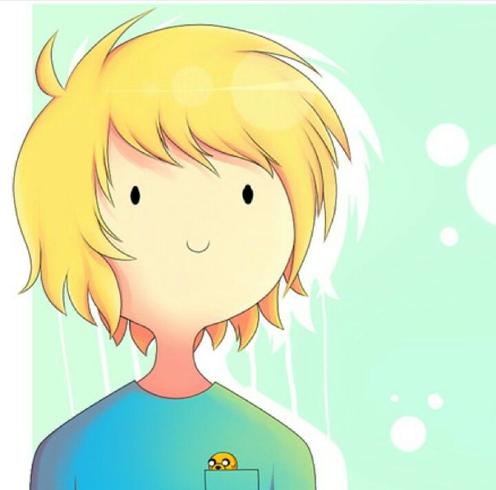 a young boy with blonde hair and blue shirt looking at bubbles in the air behind him