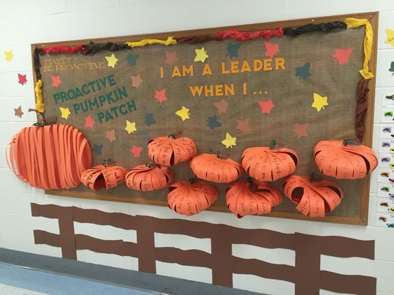 a bulletin board with paper pumpkins on it