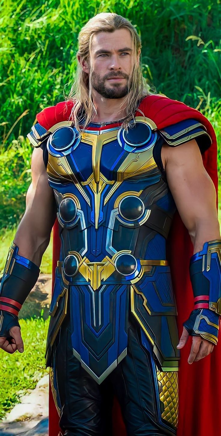 a man dressed up as thor from the movie thor is standing in front of some trees