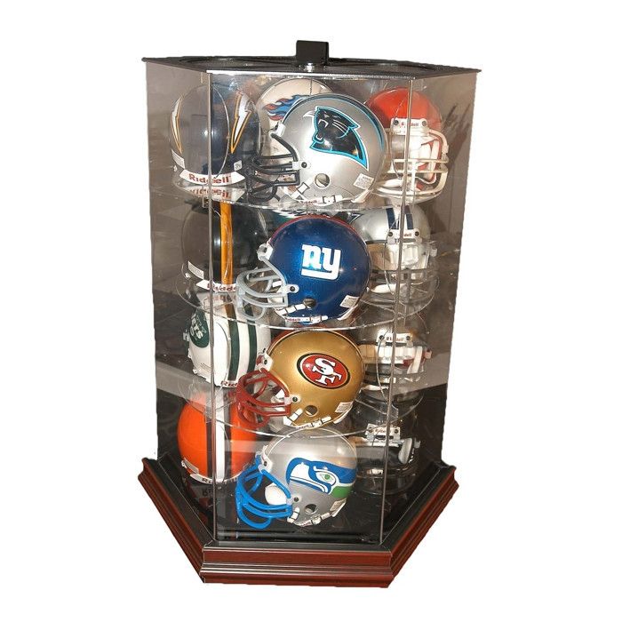 a display case with footballs, helmets and other sports memorabilia in it on a white background