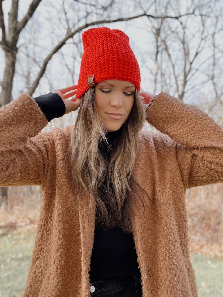 A classic everyday style for any outfit! All the warmth but no bulk. This beanie is a tighter fit, medium weight style. hand crocheted tighter stitch for extra warmth bright red 'Made in Minny' Faux Vegan Leather Tag in whiskey Medium weight, perfect for everyday 100% acrylic Spot clean if necessary, lay flat to dry Warm Solid Color Crochet Hat, Fitted Beanie For Cold Weather In Fall, Fitted Fall Beanie, Fitted Knitted Beanie For Fall, Casual Fitted Beanie For Fall, Winter Knit Crochet Hat, Fitted Soft Knit Beanie For Fall, Warm Crochet Hat For Cold Weather In Fall, Fall Crochet Hat In Solid Color With Soft Knit