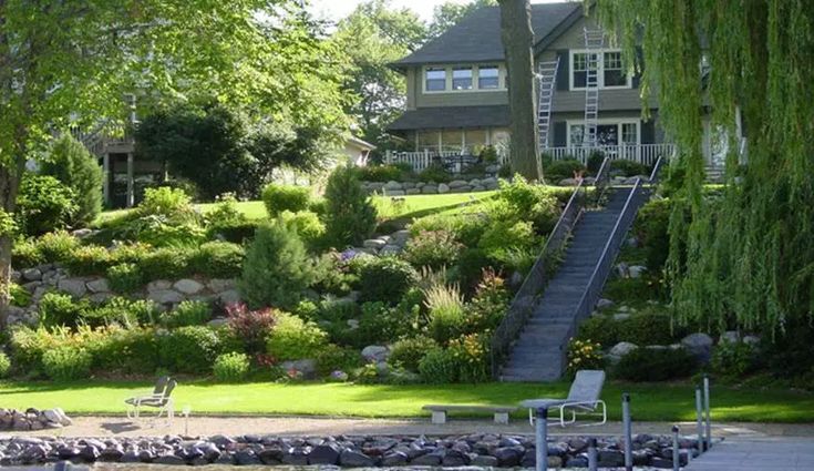 there is a house on the water with stairs going up to it