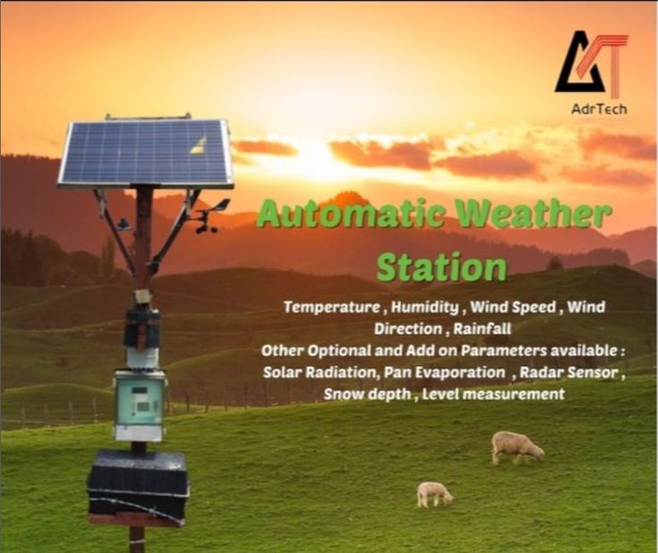 an advertisement for automatic weather station with sheep grazing in the field and sun setting behind it