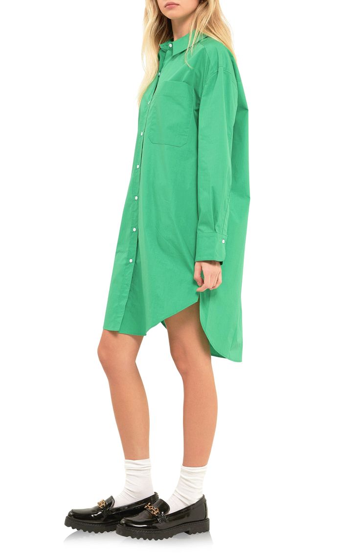 Exude effortless style in this oversized shirtdress that has a subtle high-low hem and crisp cotton feel that is sure to keep you comfortable. Spread collar Long sleeves 100% cotton Hand wash, dry flat Imported Oversized Solid Casual Shirt Dress, Casual Oversized Solid Color Shirt Dress, Casual Oversized Solid Shirt Dress, Classic Shirttail Hem Shirt Dress For Daywear, Solid Color Cotton Shirt Dress For Work, Casual Shirt Dress With Shirttail Hem For Work, Solid Color Cotton Knee-length Shirt Dress, Classic Cotton Shirt Dress With Relaxed Fit, Classic Cotton Knee-length Shirt Dress