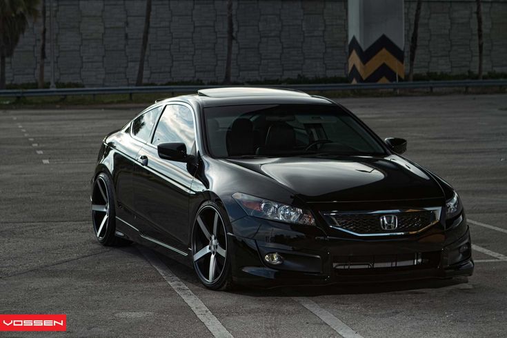 a black car parked in a parking lot