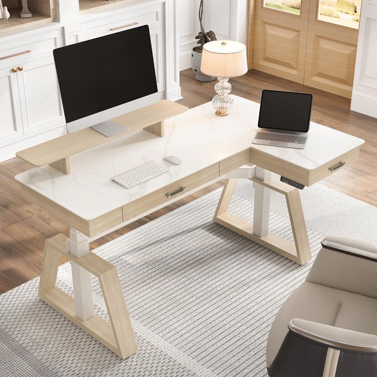 a computer desk with a laptop on top of it