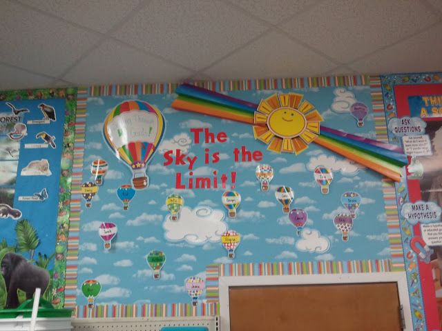 the sky is the limit bulletin board with hot air balloons and rainbows on it