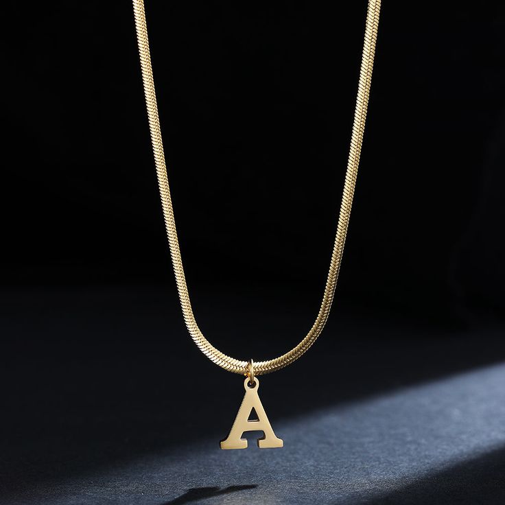 Let your style shine with this A-Z Alphabet Gold Plated Stainless Steel Pendant Necklace! Crafted of durable gold-plated stainless steel for a lasting shine, this stylish necklace will have you looking like a timeless fashionista. Make a statement today. Gold Metal Initial Pendant Necklace, Gold Metal Pendant Initial Necklace, Metal Initial Pendant Necklaces Tarnish Resistant, Gold Initial Pendant Chain Necklace, Gold Metal Initial Pendant Chain Necklace, Yellow Gold Initial Pendant Necklaces, Gold Metal Chain Necklace With Initial Pendant, Elegant Gold Metal Initial Necklace, Gold Pendant Initial Necklace