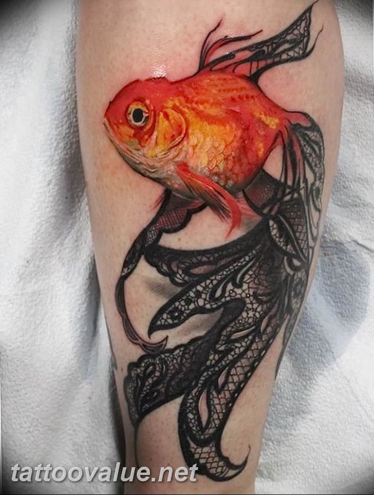 a goldfish tattoo on the leg