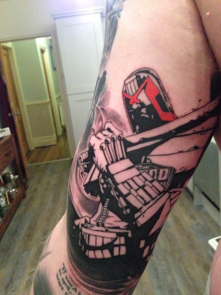 a man's leg with a tattoo on it that has an image of a fighter jet