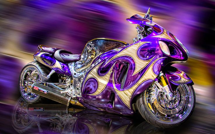 a purple and gold motorcycle is shown in this artistic photo with its reflection on the ground