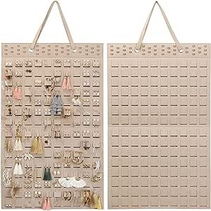 two large beige wall hangings with earrings on them and one in the shape of an earring holder