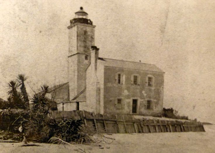 an old black and white photo of a lighthouse