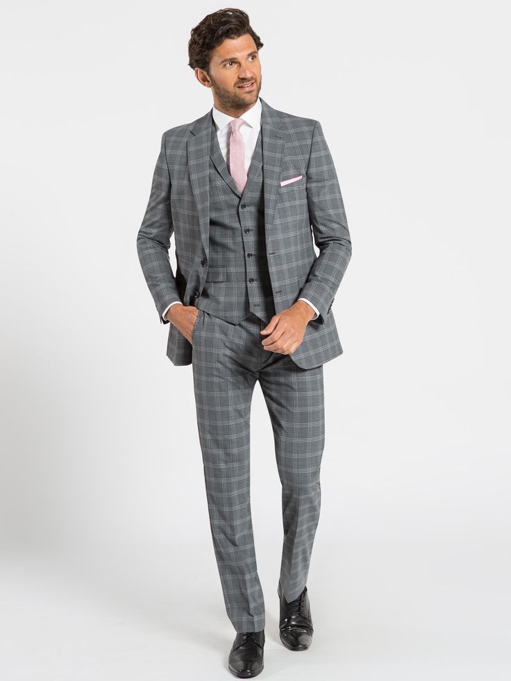 Suits are always in and especially when it comes to this timeless grey check pattern three piece suit from the Sleek Street Collection. This suit features a single-breasted blazer with five button closure waistcoat which is sure to be a staple in your wardrobe this season. The slim cut ensures that it fits you perfectly in all the right places and the design also gives versatility which will be perfect for all of your occasions. This suit works well paired with all your brighter ties however it Grey Check Suit Men Wedding, Check Suit Men, Mens Suits Grey, Checked Suits Men, Grey Check Suit, Wedding Window, Mens 3 Piece Suits, Grey Suit Wedding, Grey Suit Men