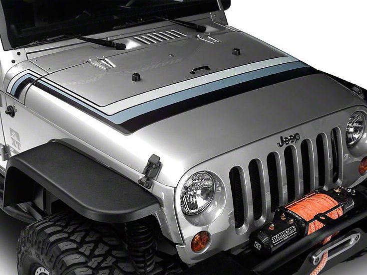 the front end of a silver jeep with an open hood and light bars on it