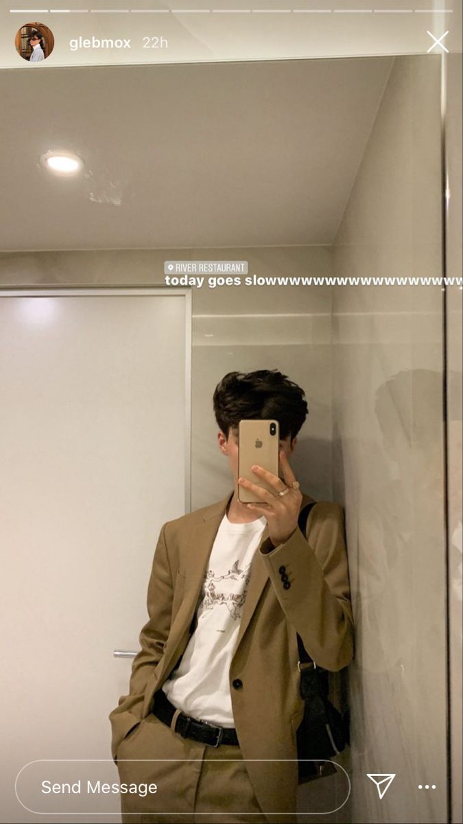 a man taking a selfie in front of a mirror