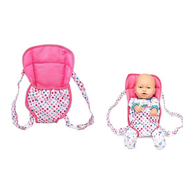 a baby in a pink and white polka dot print carrier next to an infant doll