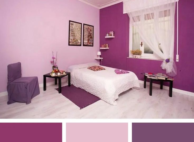 a bedroom with purple walls and white furniture