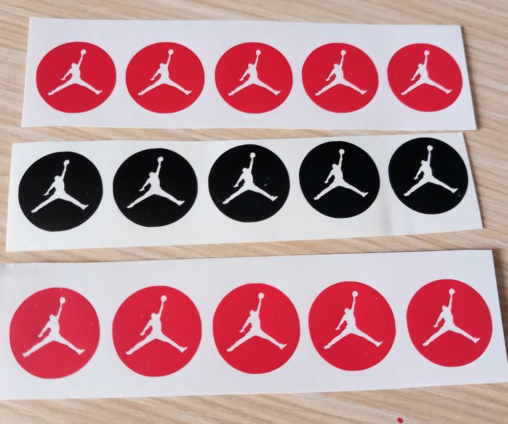 four stickers with the logos of different sports teams on them