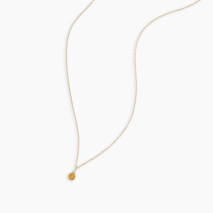 A modern heirloom. Introducing our take on a traditional style. Whether you wear yours or a loved one’s, a birthstone necklace is an easy way to add color and meaning to your look. This birthstone necklace features a 14k gold chain and diamond detail and makes for a perfect, personal gift. Citrine is November's birthstone. Product Details Diamond: 0.01 total carat weight, 1.3 mm GH SI1-SI3 Citrine: 0.15 total carat weight, 3 mm genuine citrine 14k solid gold 16" chain + 2" extender. Adjustable i Delicate Chain Pendant Birthstone Necklace, Fine Jewelry Birthstone Necklace With Delicate Chain, Gold-plated Birthstone Necklace With Gemstones, Yellow Gold Solitaire Pendant Necklace With Birthstone, Gold Plated Birthstone Charm Necklace With Round Pendant, Gold Birthstone Necklace With Round Pendant, Gold Plated Birthstone Pendant Necklace, Gold Plated Birthstone Charm Necklaces With Round Pendant, Elegant Gold Birthstone Necklace In Recycled Gold