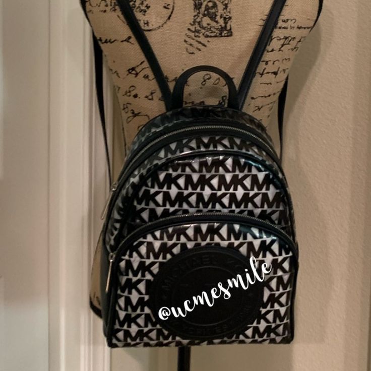 Michael Kors Monogram Casual Style 2way Logo Backpack Nwt! Michael Kors Clear Medium Backpack Black/Black Leather/Plastic Perfect For Vacations, Everyday Use, Sports Events Any Event That Requires A See Through Bag. Signature Plastic, Thermoplastic Polyurethane With Trim Leather Color: Black Double Zip Closure Main Compartment: Zip & 2 Slip Pockets Exterior Pocket Silver Tone Hardware Top Handle 3" Drop Adjustable Leather Straps 12.5"L X 10.5"W X 5"H Smoke Free Home Will Wrap With Care Rare Find Monogram Backpack, Medium Backpack, Bags Michael Kors, Black Backpack, Michael Kors Black, Sport Event, Michael Kors Monogram, Save You, Top Handle