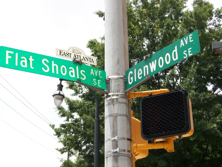 the street signs are clearly visible for us to see on this pole, which is located at the corner of flat shoals ave and glennwood se