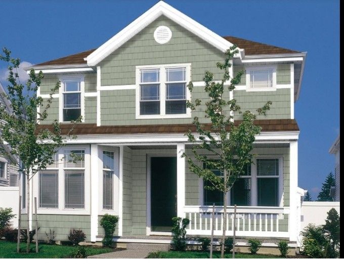 a gray house with white trim and windows