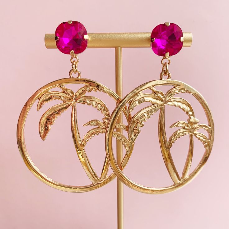 The kind of earrings made for posing in a bikini while sipping something delicious out of a coconut! Stunning oversize golden front-facing hoops show the silhouette of two palm trees in a cut-out style. The faux gem studs come in either a lovely deep emerald green or eye-catching hot pink. Lovingly handmade in Edinburgh, Scotland Miss Kitsch UK shop: misskitschuk.etsy.com ♥ USEFUL INFORMATION ♥ ♦ Postage - UK - 2nd class post. Estimated delivery 2-3 days. In rare cases (outside of my control!) t Palm Tree Jewelry, Gold Palm Tree, Kpop Earrings, Deep Emerald Green, Vacation Jewelry, Tree Earrings, Earring Tree, Edinburgh Scotland, Holiday Vacation