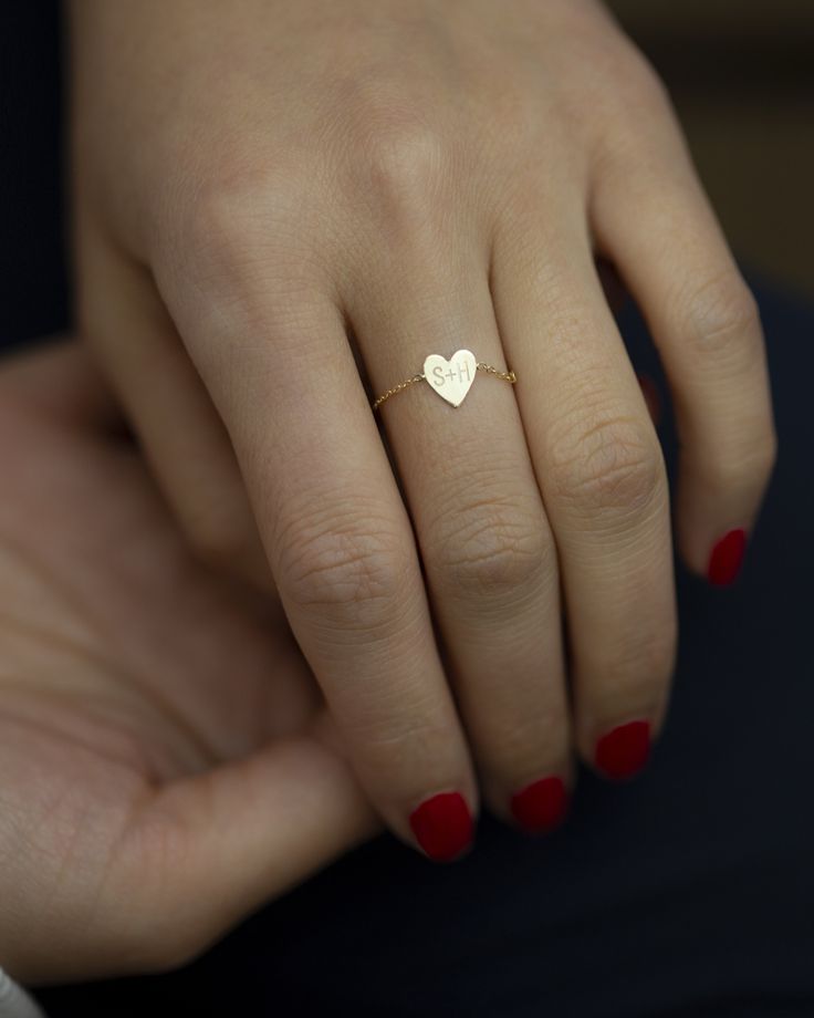 Dainty 14k gold Little Heart chain ring. Personalize this chain ring with up to 4 characters of your choice. Dainty light chain ring style, Perfect as a stacking ring or by itself. Mini heart charm measures approx. 6.5 X 7.5mm Dainty 14k Gold Initial Ring Tarnish Resistant, Dainty 14k Gold Personalized Initial Ring, Dainty Personalized 14k Gold Initial Ring, Dainty Sterling Silver Initial Ring Stamped 14k, Minimalist 14k Gold Jewelry For Valentine's Day, Simple 14k Gold Jewelry For Valentine's Day, Dainty Simple Jewelry For Valentine's Day, Dainty White Gold Heart Ring, Gold Sterling Silver Heart Ring For Valentine's Day