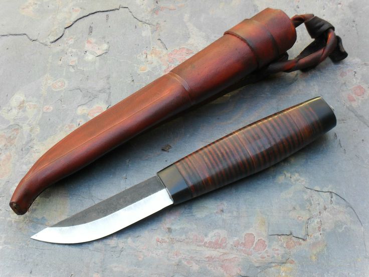 a knife and sheath laying on the ground