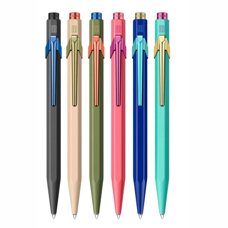 four different colored pens are lined up next to each other