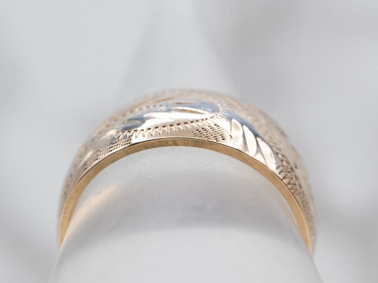 So many wonderful details come together to give this vintage band a rich, textural feel! Crafted of 14 karat yellow gold, this is a great band for stacking or wearing traditional as a wedding band!Metal: 14K Yellow GoldWidth of Band: 8.0 mmHeight off Finger: 1.4 mmRing Size: 6Marks: “<14K>” Stamped on the inside band Engraved Yellow Gold Band Ring, Etched Yellow Gold Bands For Anniversary, Yellow Gold Engraved Band Rings, Yellow Gold Etched Bands For Anniversary, Heirloom Yellow Gold Stackable Rings, Gold Bands With Diamond Cut, Wide Band Yellow Gold Fine Jewelry, Yellow Gold Wide Band Fine Jewelry, Wide Band In Yellow Gold Fine Jewelry Style