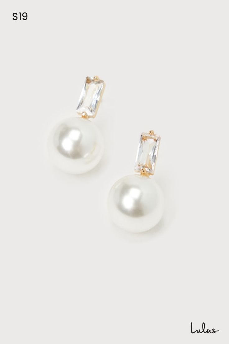 When you need to complete any special occasion look, the Lulus Elegant Passion White Pearl 14KT Gold Rhinestone Stud Earrings are the most stunning way to do so! These sophisticated earrings start with baguette-shaped rhinestone posts (with 14KT gold-plated settings) that support a gleaming, oversized faux pearl charm that completes the poised look. Make sure to wear an updo so you can show off these perfect beauties! This item is plated with real 14KT gold. Love it and it will love you back! Remove before exercising or showering, and when applying scents, lotions and sprays. Post backs. 0. 75" Long. 14K Gold Dipped Brass 25%, Glass 15%, Plastic 60%. Imported. Lulus | Elegant Passion White Pearl 14KT Gold Rhinestone Stud Earrings. Pearl And Diamond Drop Earrings, Wedding Jewelry Strapless Dress, Pearl Bride Earrings, Bride Earrings Pearl, Sophisticated Earrings, Pearl Drop Earrings Bridal, Bridal Jewellery Earrings, Formal Earrings, Bridesmaid Earrings Gold