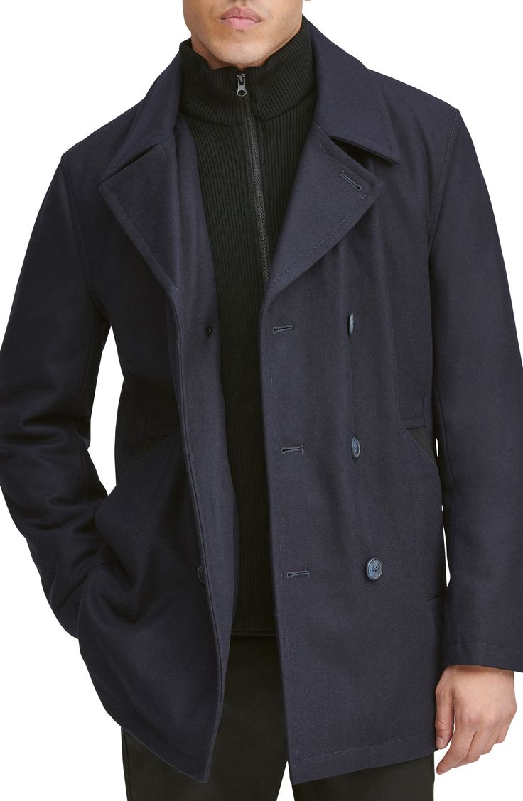 A hearty wool blend enriches a classic peacoat with a smart internal bib for added warmth and protection. 33" length Double-breasted button closure Notched lapels Side welt pockets Lined, with 100% polyester fill 46% wool, 40% polyester, 5% acrylic, 4% nylon, 3% rayon, 2% cotton Dry clean Imported Men's Clothing Collared Single-breasted Pea Coat For Winter, Navy Double-breasted Business Outerwear, Navy Fitted Double-breasted Outerwear, Tailored Peacoat With Buttons And Lapel Collar, Navy Tailored Outerwear With Buttons, Tailored Navy Outerwear With Buttons, Winter Navy Double-breasted Blazer, Winter Navy Blazer With Double-breasted Buttons, Navy Double-breasted Blazer For Winter