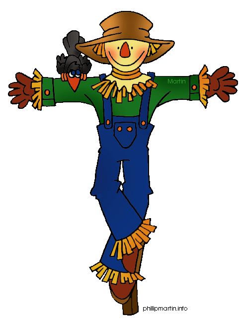 a scarecrow holding a black cat on his arm and wearing a green shirt with yellow trim