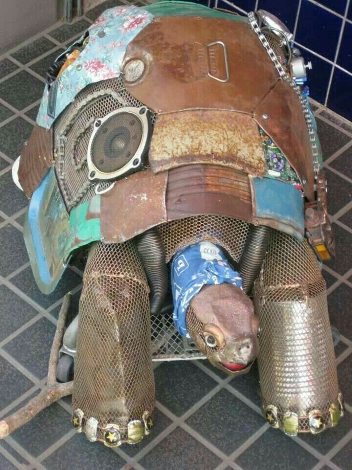 an animal made out of various items on the ground