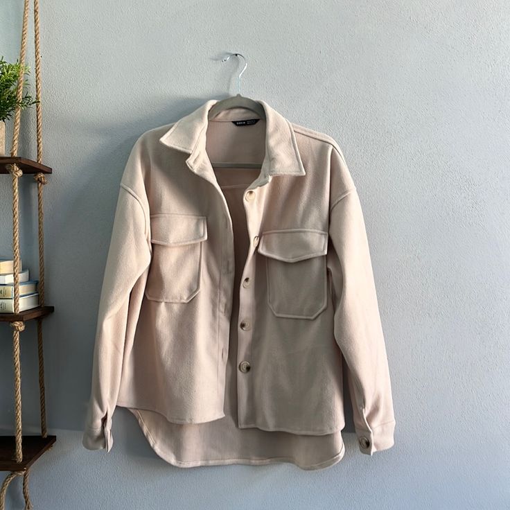 Never Worn And In Perfect Condition! 100% Polyester Beige Single Breasted Shacket For Everyday, Cream Single-breasted Button-up Outerwear, Beige Long Sleeve Shacket With Buttoned Pockets, Oversized Beige Utility Jacket With Button Closure, Trendy Beige Button-up Blazer, Everyday Button-up Outerwear With Flap Pockets, Beige Collared Utility Jacket With Button Closure, Beige Collared Outerwear With Button Closure, Beige Collared Shacket With Snap Buttons