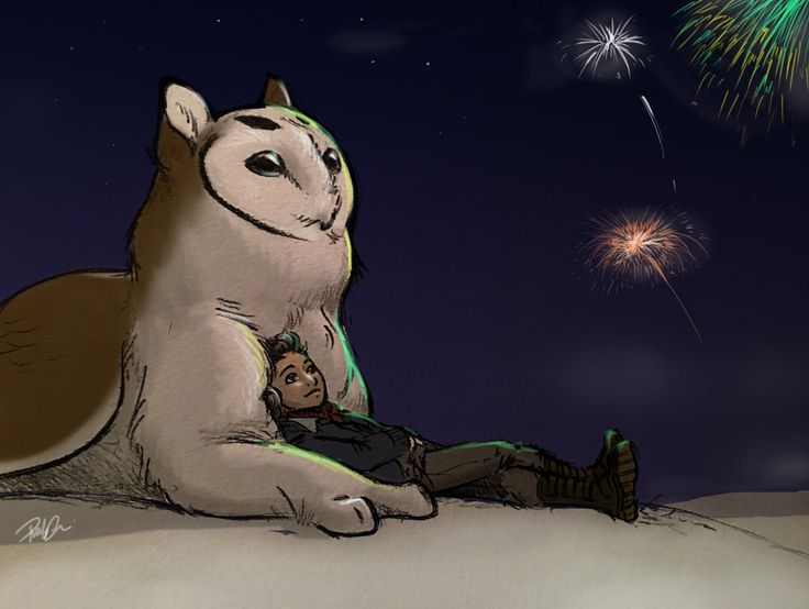 a man laying on the ground next to a dog with fireworks in the sky behind him