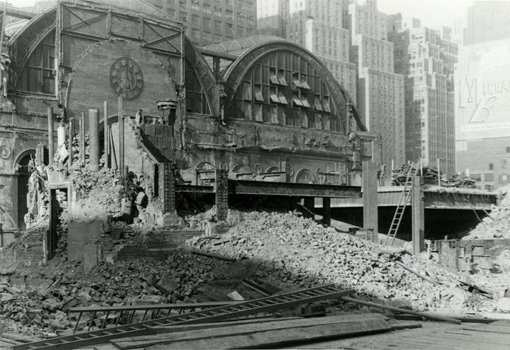 an old black and white photo of a building that has been demolished