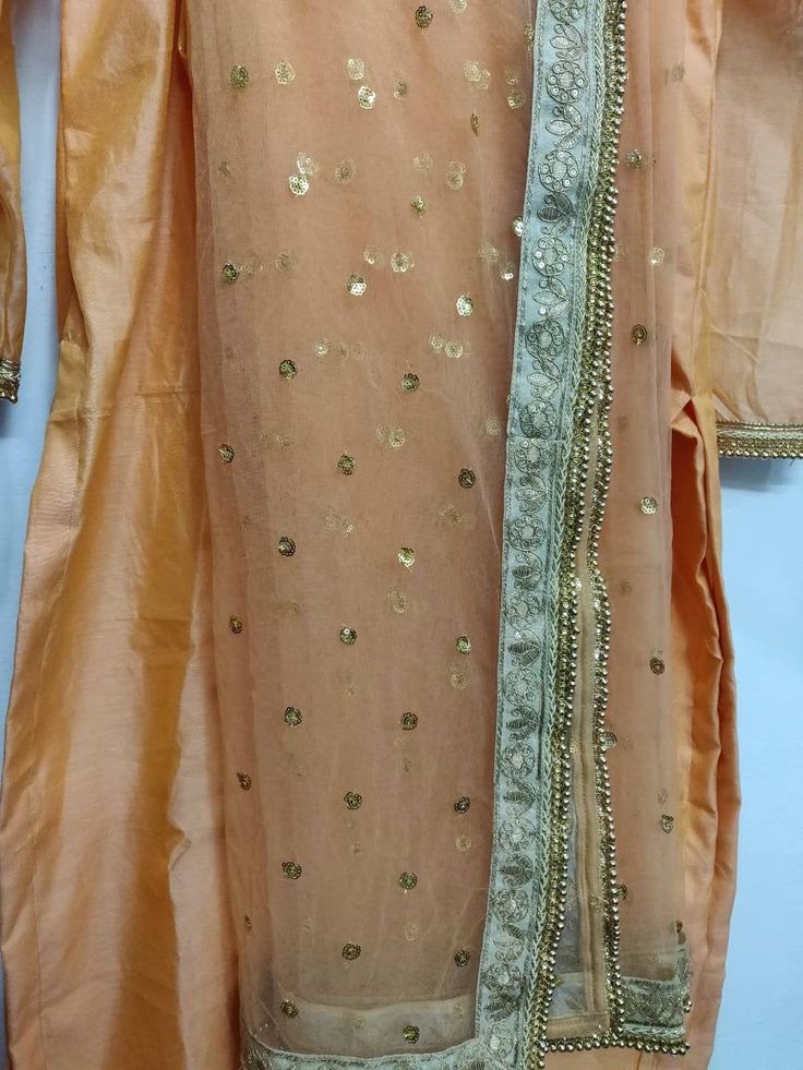 This is a made to measure Salwar Kameez suit I make it exclusively for my customers by using designer fabrics. I will only make it after you confirm your required size details. Handling Time: Don't worry, just tell me, I will process it accordingly and deliver on or before a delivery date you mention. Size: This is custom made as per your size. Post your order I will send you a measuremnts reference sheet using which you can provide details required to make your outfit. Fabric and work: Kameez m Floor-length Mirror Work Churidar For Festive Occasions, Semi-stitched Floor-length Salwar Kameez With Gota Work, Festive Orange Kurta With Gota Work, Traditional Drape Churidar With Mirror Work, Bollywood Style Floor-length Kurta With Mirror Work, Orange Semi-stitched Kurta With Pallu, Designer Orange Salwar Kameez With Pallu, Chanderi Churidar With Mirror Work, Unstitched Anarkali Dress With Gota Work