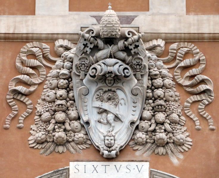 an ornate design on the side of a building with a sign that says sixtvsv