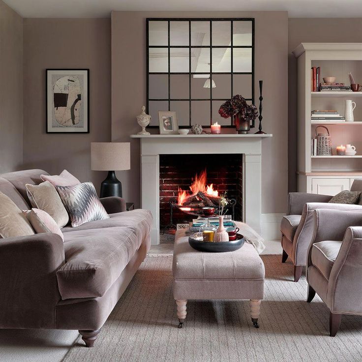 a living room filled with furniture and a fire place